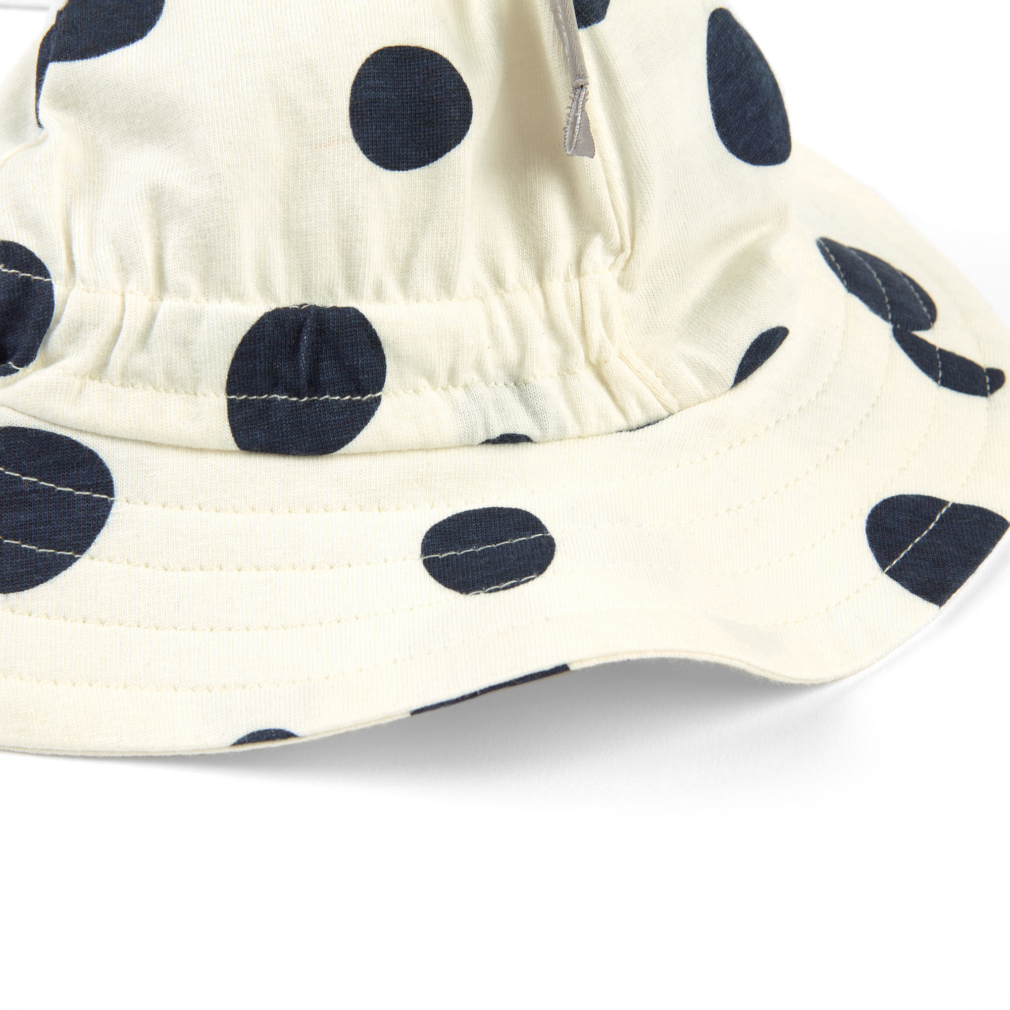 Brimmed sun hat for little girls, white/blue dots