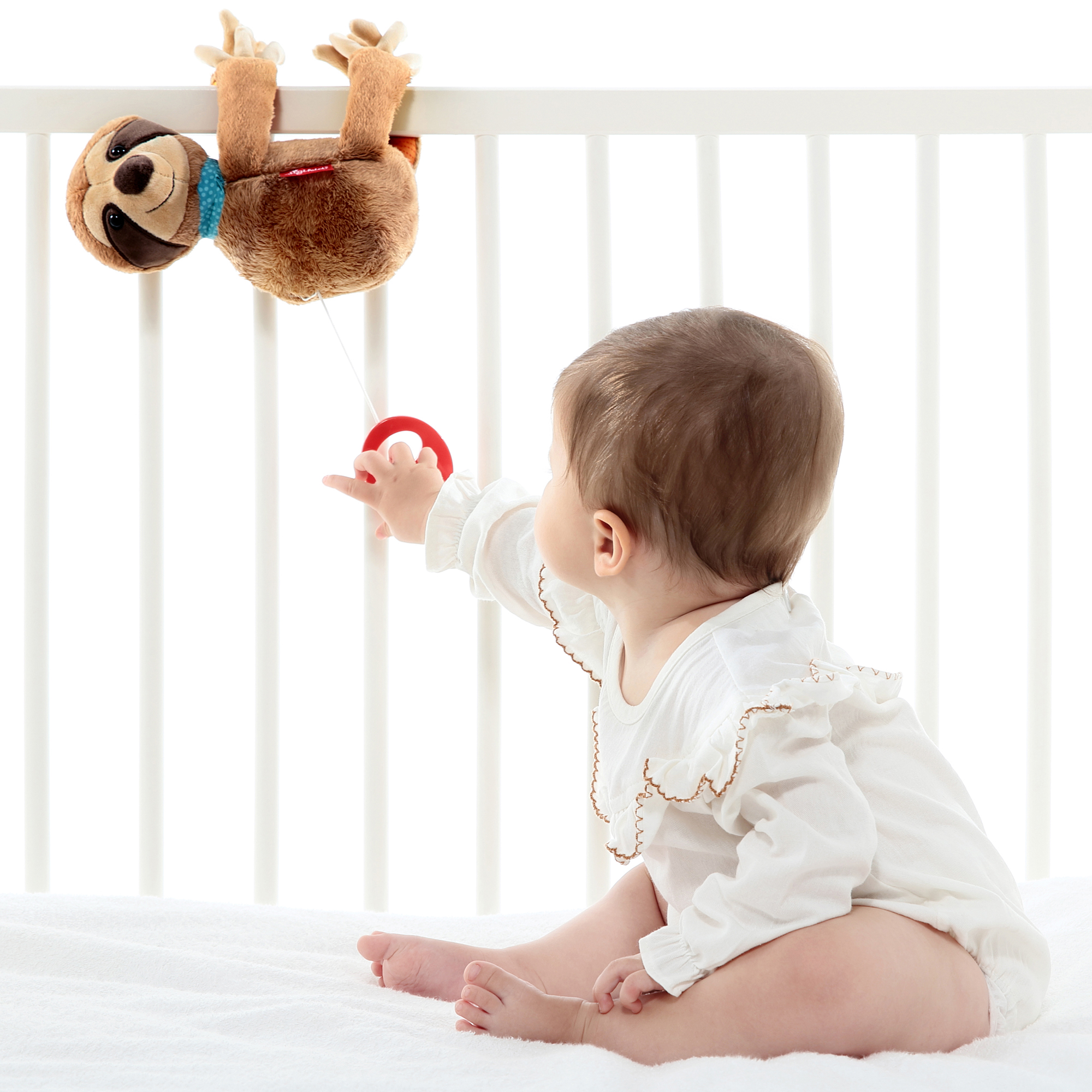 Hanging musical toy sloth