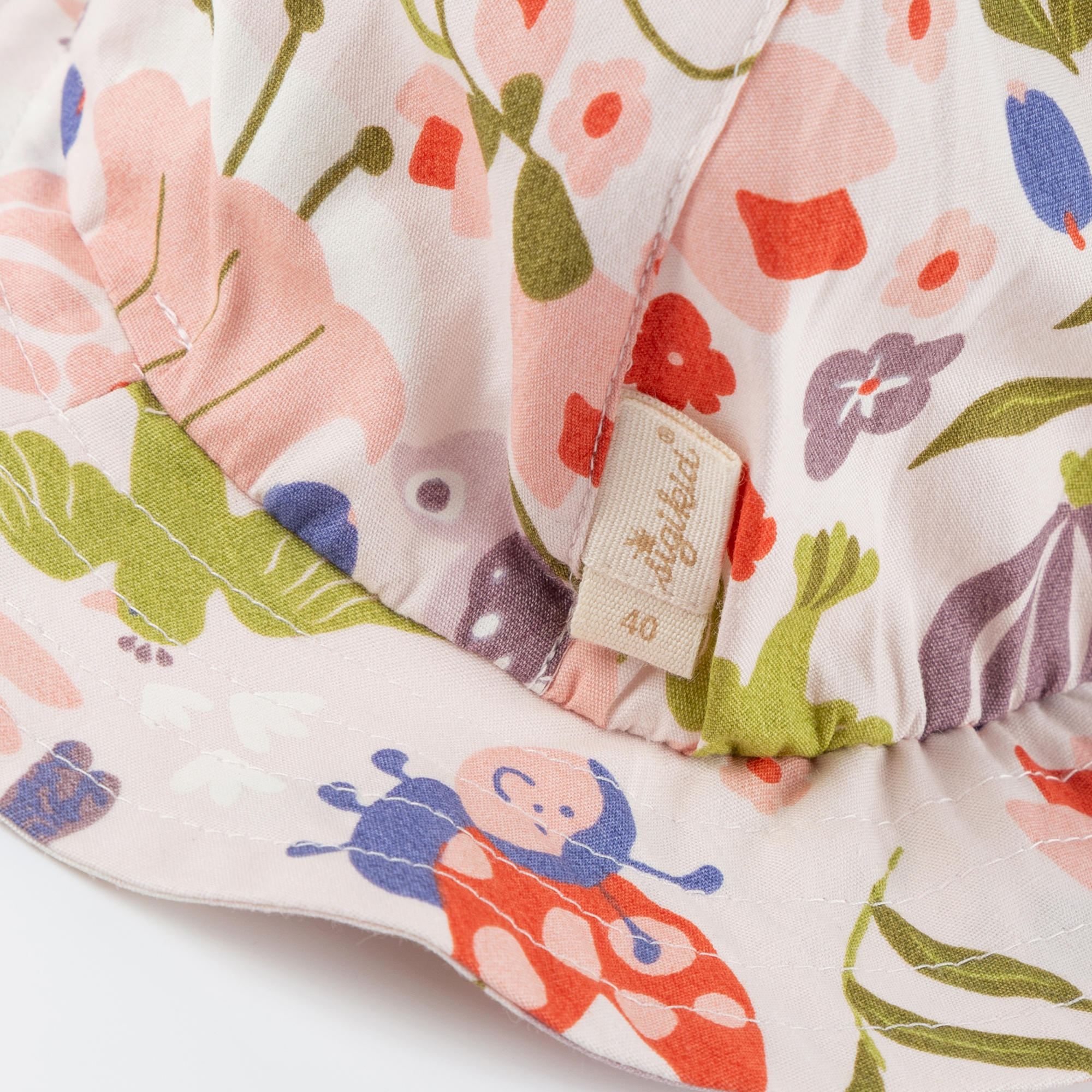 Baby Sonnenhut Marienkäfer mit Blumenprint Baby Sonnenhut Marienkäfer mit Blumenprint