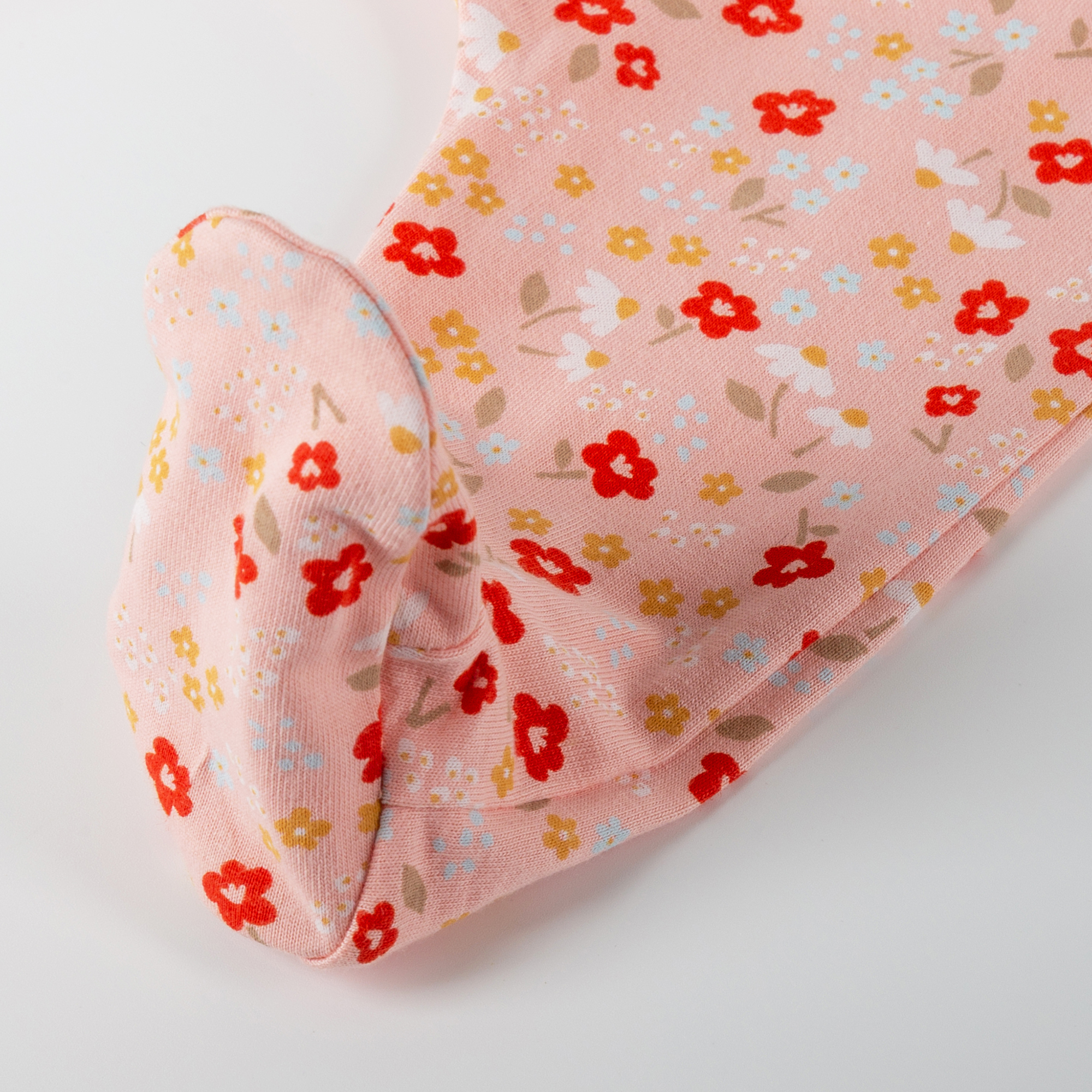 Flowery newborn baby footed romper, long sleeves