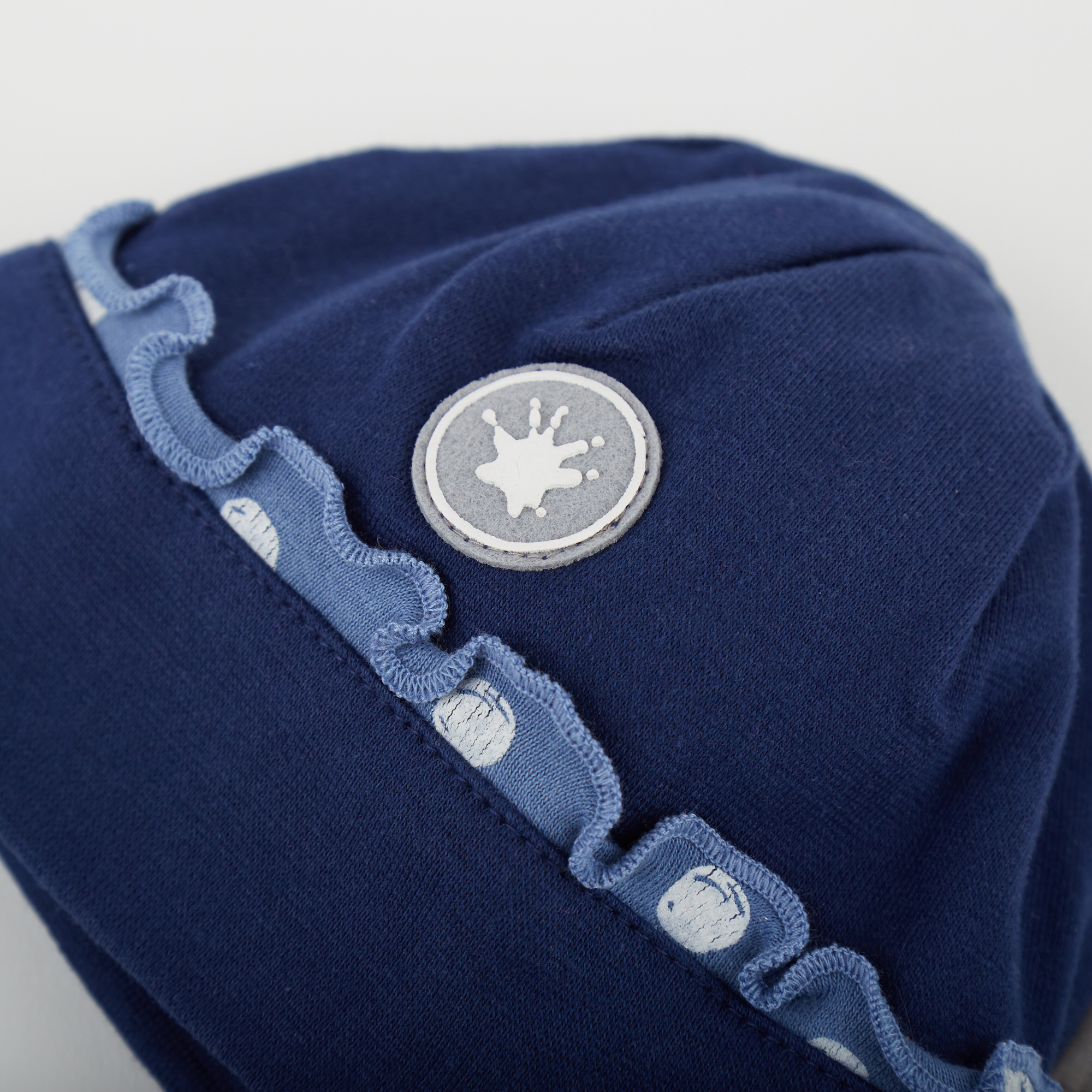 Warm baby girl beanie hat with curly edge detailing Warm baby girl beanie hat with curly edge detailing