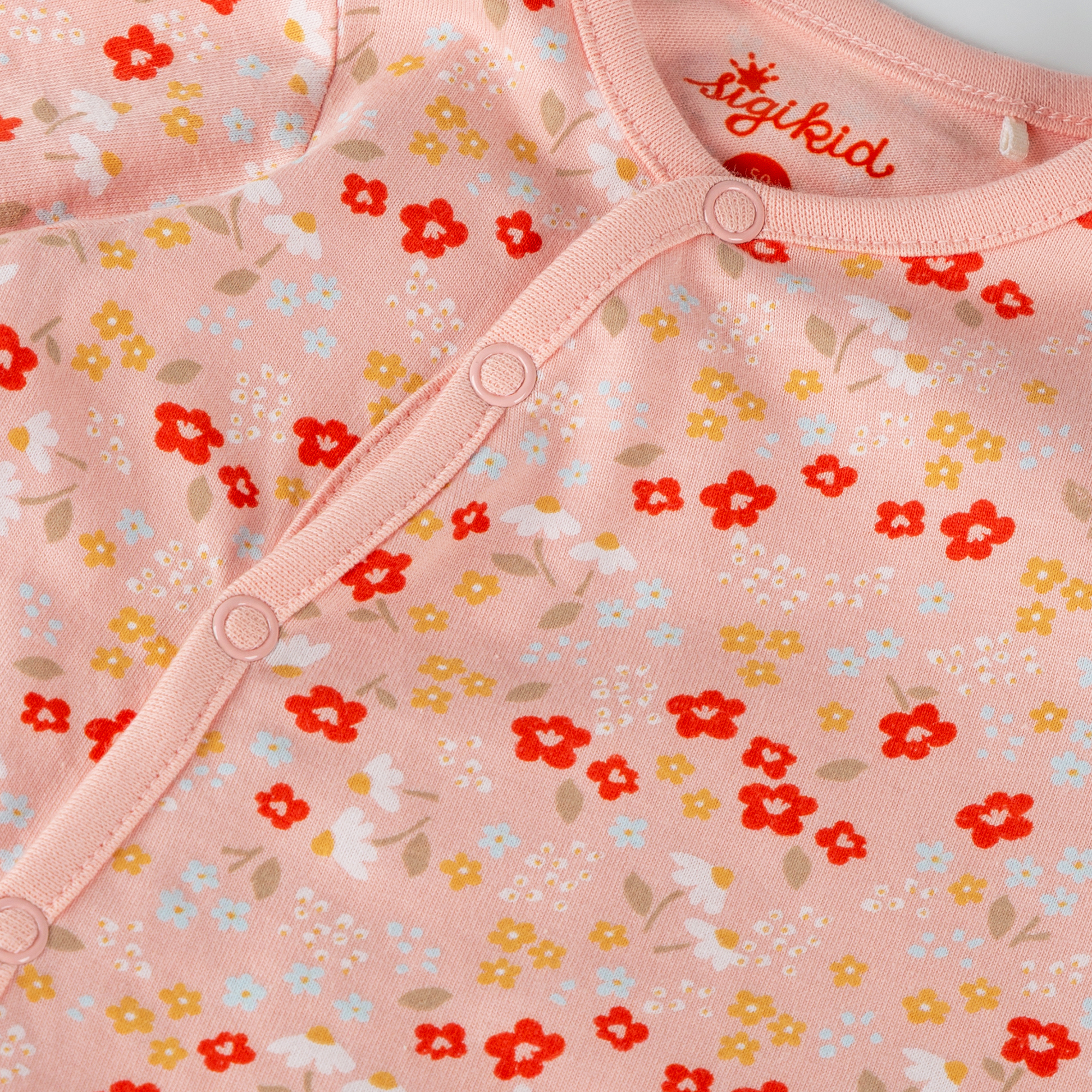 Flowery newborn baby footed romper, long sleeves